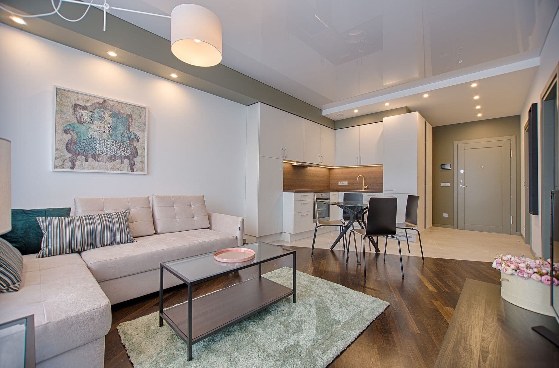 Modern villa interior with large-format tiled floors in the kitchen and living area